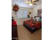 Bedroom with a ceiling fan and a bed with colorful bedding at 11424 S Obispo Dr, Goodyear, AZ 85338