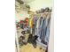 Walk-in closet with shelving and clothing at 11424 S Obispo Dr, Goodyear, AZ 85338
