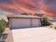 Attractive single-level home boasting a three-car garage and low-maintenance landscaping at 11424 S Obispo Dr, Goodyear, AZ 85338