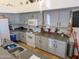 Well-lit kitchen features modern appliances, light countertops and gray cabinets at 11424 S Obispo Dr, Goodyear, AZ 85338