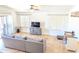 Comfortable living space featuring tile flooring, a ceiling fan, and sliding doors for easy patio access at 11424 S Obispo Dr, Goodyear, AZ 85338