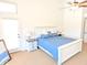 Bright main bedroom with carpet flooring, ceiling fan, and access to a patio at 11424 S Obispo Dr, Goodyear, AZ 85338