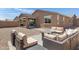 Cozy backyard featuring outdoor seating arranged around a fire pit, with a patio at 1221 E Jahns Dr, Casa Grande, AZ 85122