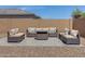 Backyard featuring a gravel section and outdoor seating arranged around a fire pit on a patio at 1221 E Jahns Dr, Casa Grande, AZ 85122