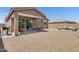 Backyard with gravel, patio, seating, and partial shade from a covered patio at 1221 E Jahns Dr, Casa Grande, AZ 85122