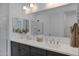 Modern double vanity bathroom with undermount sinks, sleek faucets and coordinated accessories at 1221 E Jahns Dr, Casa Grande, AZ 85122
