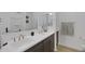 Bathroom with double vanity, framed mirrors, and white tile at 1221 E Jahns Dr, Casa Grande, AZ 85122