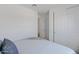 Bright bedroom with white walls, plush bed, and closet with white doors at 1221 E Jahns Dr, Casa Grande, AZ 85122