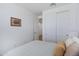 Minimalist bedroom with neutral tones, closet and a soft, inviting bed at 1221 E Jahns Dr, Casa Grande, AZ 85122