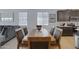 Elegant dining area with a wooden table and chairs, adjacent to the kitchen at 1221 E Jahns Dr, Casa Grande, AZ 85122