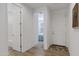 Bright entryway with wood floors, leading to a bedroom and bathroom at 1221 E Jahns Dr, Casa Grande, AZ 85122