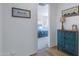 Hallway that connects to the bedroom, with an accent cabinet and neutral walls at 1221 E Jahns Dr, Casa Grande, AZ 85122