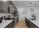View of kitchen with stainless steel appliances, white countertops and wood flooring at 1221 E Jahns Dr, Casa Grande, AZ 85122
