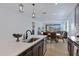 Open concept kitchen with large island flowing into the dining and living areas at 1221 E Jahns Dr, Casa Grande, AZ 85122