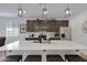 Bright kitchen featuring a large island with sink, stainless steel appliances and decorative lighting at 1221 E Jahns Dr, Casa Grande, AZ 85122