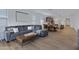 Stylish living room with a comfortable gray sectional sofa and wood-look floors at 1221 E Jahns Dr, Casa Grande, AZ 85122