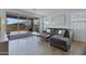 Cozy living room with a gray sofa, leading to an outdoor patio through sliding glass doors at 1221 E Jahns Dr, Casa Grande, AZ 85122