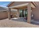 View of a covered patio with a grill, seating, and sliding glass doors at 1221 E Jahns Dr, Casa Grande, AZ 85122