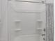 Clean white shower with built-in shelving at 1221 E Jahns Dr, Casa Grande, AZ 85122