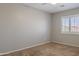 Bedroom with neutral walls, carpet, and a window with blinds at 12801 W Sweetwater Ave, El Mirage, AZ 85335