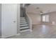 Entryway and staircase leading to open concept living room and dining at 12801 W Sweetwater Ave, El Mirage, AZ 85335