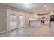 Eat-in kitchen and breakfast area with backyard access, island, and stainless steel appliances at 12801 W Sweetwater Ave, El Mirage, AZ 85335