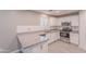 Bright kitchen featuring granite countertops, stainless steel appliances, and white cabinets at 12801 W Sweetwater Ave, El Mirage, AZ 85335