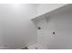 Laundry room with white walls, one shelf, and a drainage hole for a washing machine at 12801 W Sweetwater Ave, El Mirage, AZ 85335