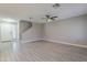 The living room with tile floors features the stairway and entry to the home at 12801 W Sweetwater Ave, El Mirage, AZ 85335