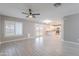 An open floor plan offers natural light and airy feel, connecting the living space with the modern kitchen at 12801 W Sweetwater Ave, El Mirage, AZ 85335