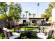 Lush backyard showcasing an outdoor seating area and a well-manicured lawn at 1309 W Lynwood St, Phoenix, AZ 85007