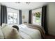 Comfortable bedroom featuring an open window, inviting natural light and showcasing the lush outdoor view at 1309 W Lynwood St, Phoenix, AZ 85007