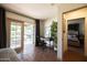 Bedroom featuring access to a backyard patio and an adjoined room with a desk at 1309 W Lynwood St, Phoenix, AZ 85007