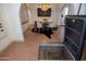 Dining room adjacent to hidden cellar access features stylish light fixture, artwork, and tile flooring at 1309 W Lynwood St, Phoenix, AZ 85007