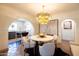 Bright dining area featuring an eye-catching light fixture and seating for four at 1309 W Lynwood St, Phoenix, AZ 85007