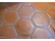 Close-up of stylish and unique red hexagon tiled flooring at 1309 W Lynwood St, Phoenix, AZ 85007