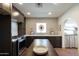 Bright and open kitchen with sleek countertops, modern cabinetry, and stainless steel appliances at 1309 W Lynwood St, Phoenix, AZ 85007