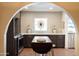 Charming kitchen featuring custom cabinetry, unique backsplash, and stainless steel appliances at 1309 W Lynwood St, Phoenix, AZ 85007