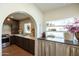 Stylish kitchen featuring updated cabinetry, modern appliances, unique decor, and ample counter space at 1309 W Lynwood St, Phoenix, AZ 85007