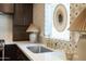Close-up of the sink area, highlighting the countertops, tilework and fixtures at 1309 W Lynwood St, Phoenix, AZ 85007