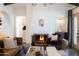 Comfortable living room showcasing a charming fireplace, hardwood floors, and stylish decor at 1309 W Lynwood St, Phoenix, AZ 85007