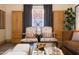 Comfortable living room featuring stylish chairs, natural light, and hardwood floors at 1309 W Lynwood St, Phoenix, AZ 85007