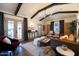 Inviting living room featuring exposed beams, wood floors, and stylish, comfortable furnishings at 1309 W Lynwood St, Phoenix, AZ 85007