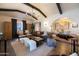 Bright living room area showcasing exposed beams, wood floors, and stylish decor at 1309 W Lynwood St, Phoenix, AZ 85007