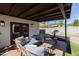 Inviting covered patio features tile flooring and cozy seating area, perfect for outdoor relaxation and entertainment at 1309 W Lynwood St, Phoenix, AZ 85007