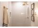 Shower with white subway tile, gold fixtures, and built-in niche at 1309 W Lynwood St, Phoenix, AZ 85007