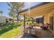 Covered patio with lush backyard and beautiful neighborhood views at 131 N Higley Rd # 41, Mesa, AZ 85205