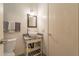 Bathroom featuring vessel sink, updated fixtures, and decorative mirror at 131 N Higley Rd # 41, Mesa, AZ 85205