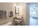 Bathroom featuring vessel sink, updated fixtures, and decorative mirror at 131 N Higley Rd # 41, Mesa, AZ 85205