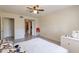 Bright bedroom featuring tile floors, white walls, and a ceiling fan at 131 N Higley Rd # 41, Mesa, AZ 85205